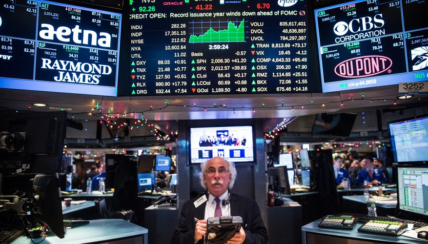 The New York Stock Exchange floor with trading data displays.