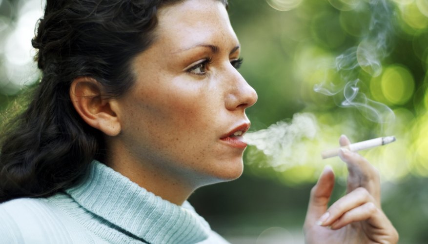 Woman smoking a cigarette Woman smoking a cigarette