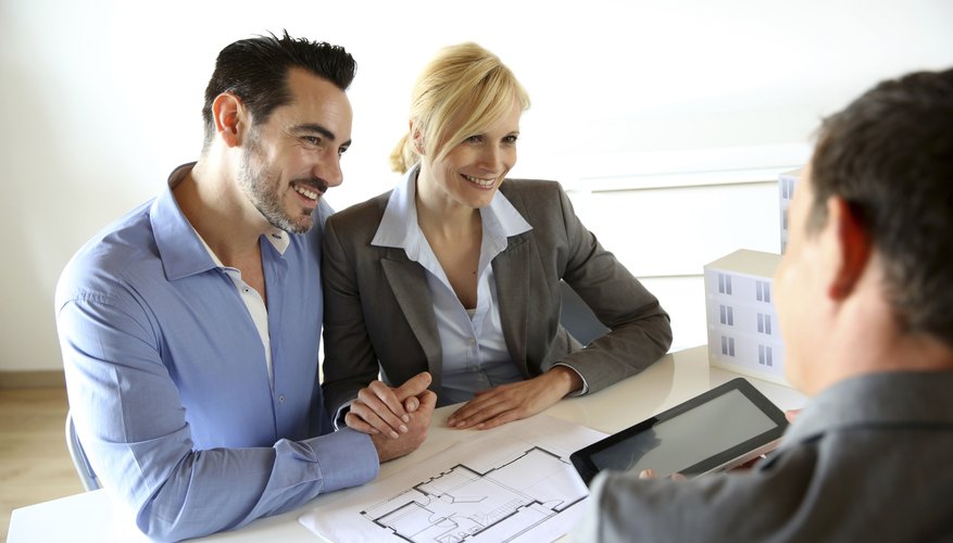 A couple is meeting with their financial adviser.