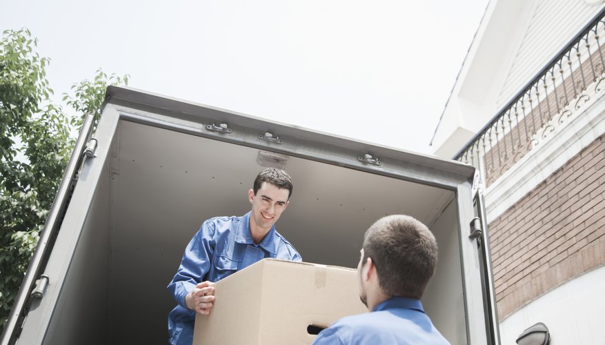 Photo Credit: XiXinXing/iStock/Getty Images Workers loading boxes