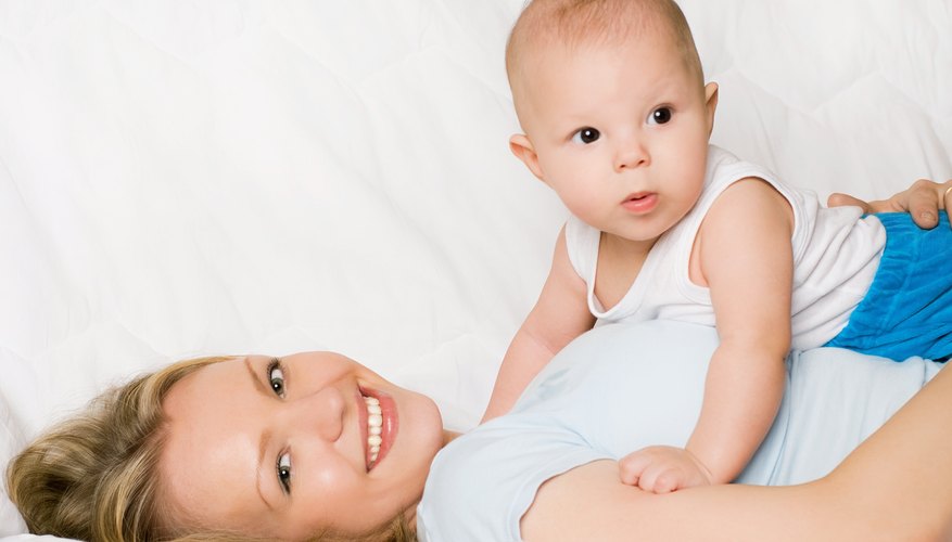 Mother with son on bed. Mother with son on bed.