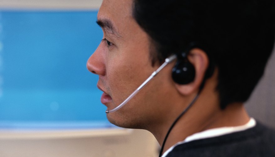 Photo Credit: Keith Brofsky/Photodisc/Getty Images A close-up of an employee working at his desk.