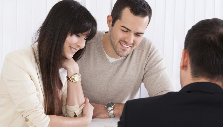 A couple is talking to a financial advisor.