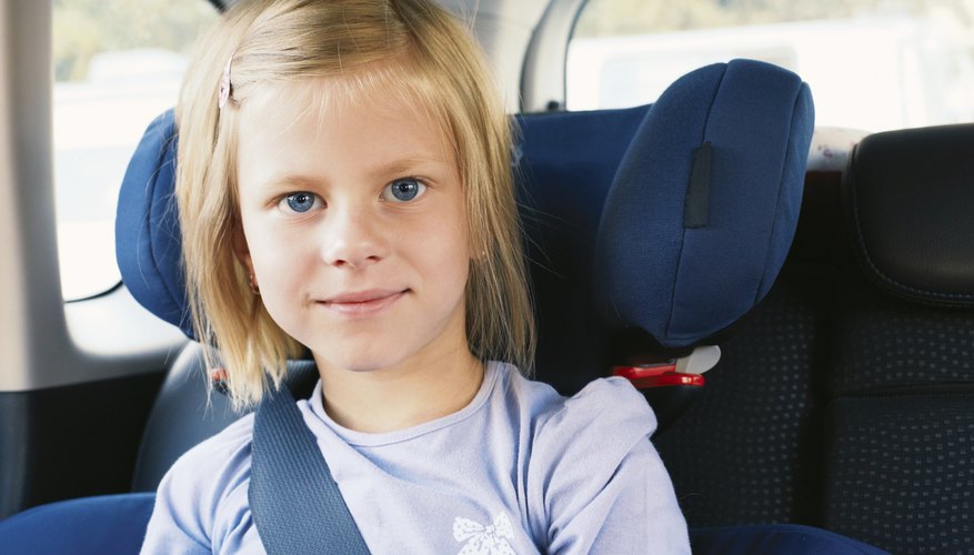 girl in car booster seat girl in car booster seat