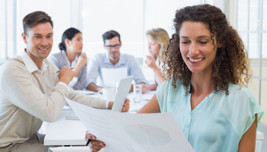 Image of a woman reading a business chart.