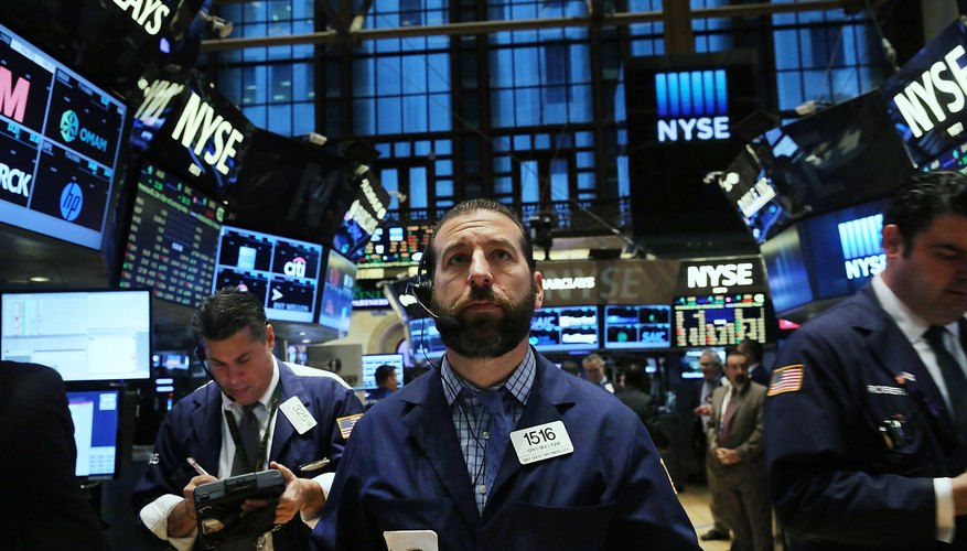 A group of brokers on the floor of the New York Stock Exchange