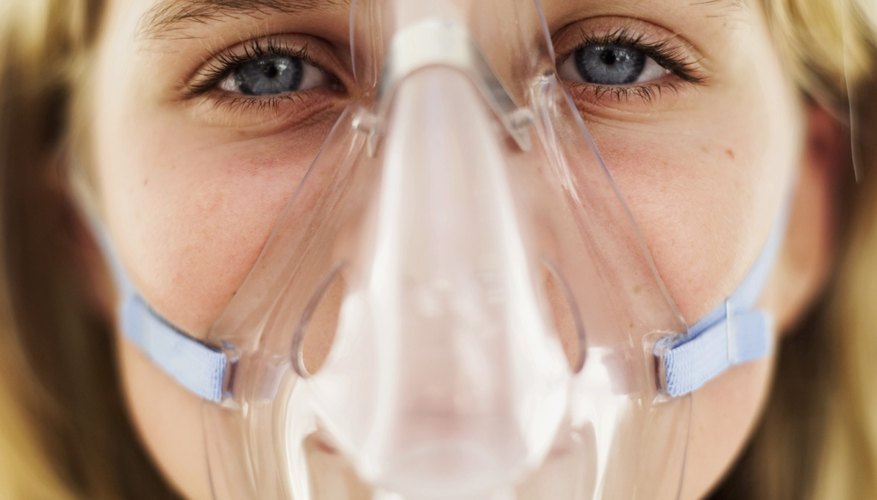 Wearing an oxygen mask Wearing an oxygen mask