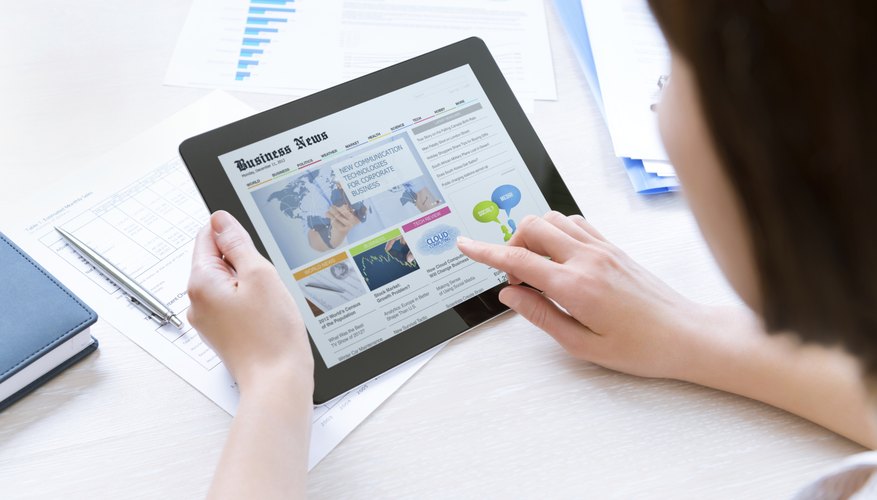 Businesswoman reading latest news