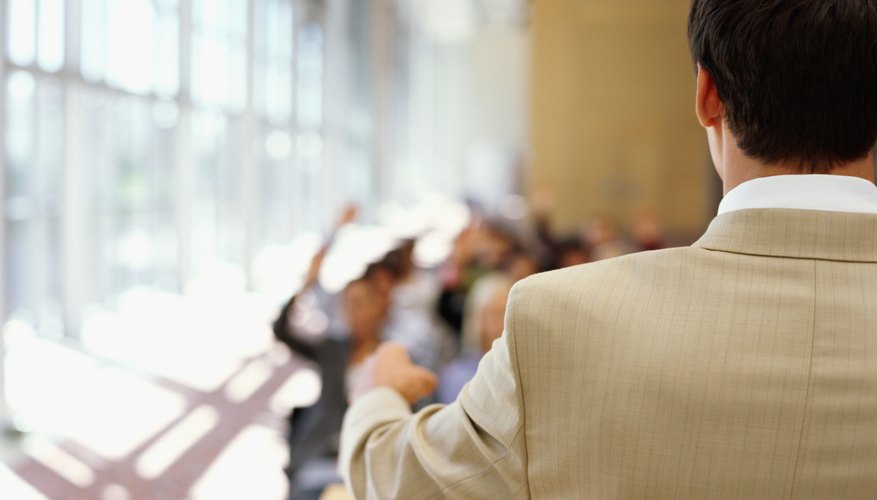 Photo Credit: George Doyle/Stockbyte/Getty Images The back of a speaker at the podium during a seminar.