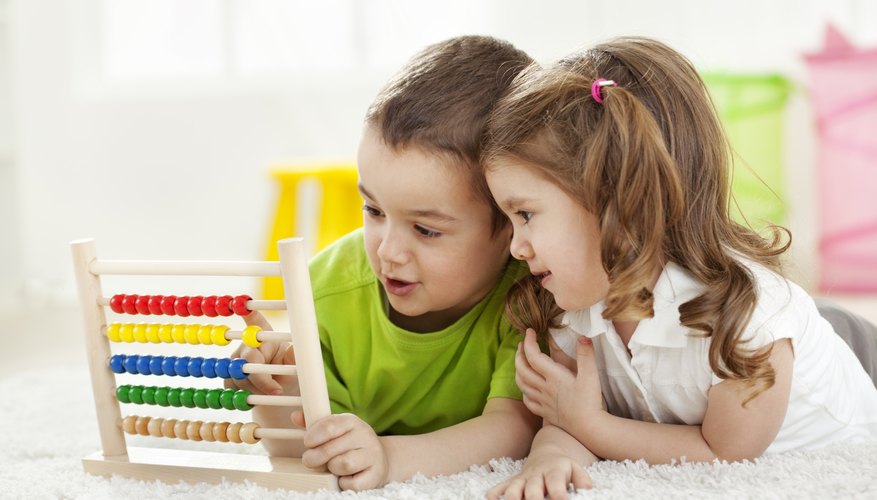 Photo Credit: Dejan Ristovski/iStock/Getty Images Young students playing with math toy.