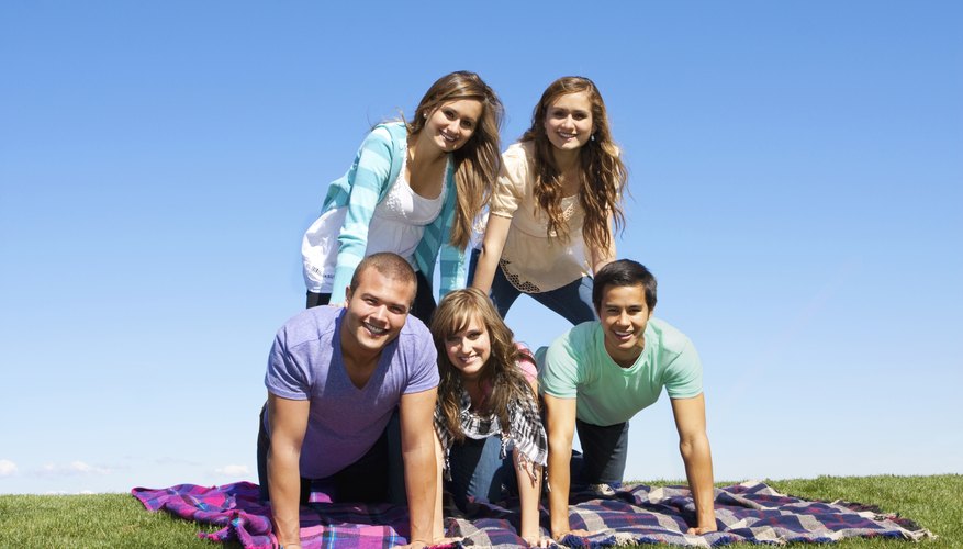Photo Credit: brocreative/iStock/Getty Images A human pyramid takes team work, coordination and skill.