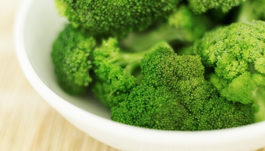 A bowl of fresh broccoli. A bowl of fresh broccoli.