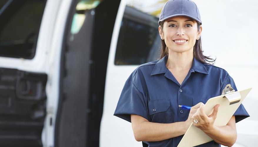 Portrait Of Female Delivery Driver With Clipboard