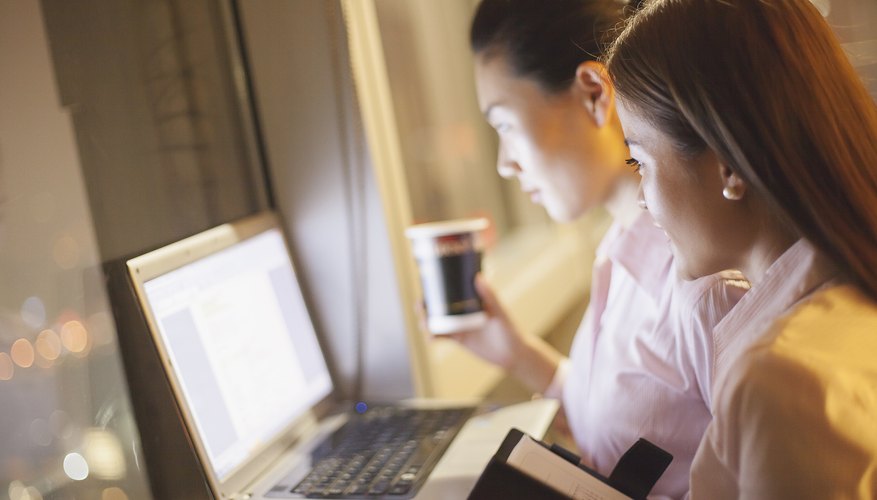A young woman is on the computer.
