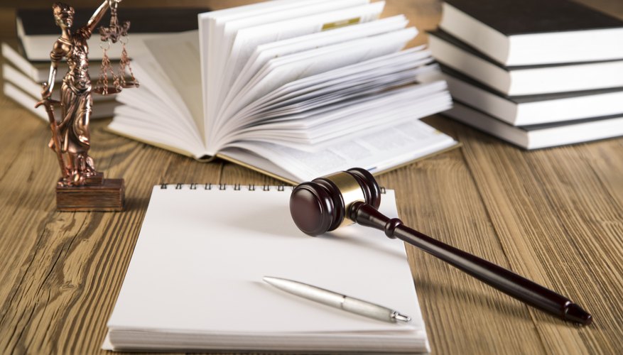 Final speech, Lady of justice, gavel and books on wood