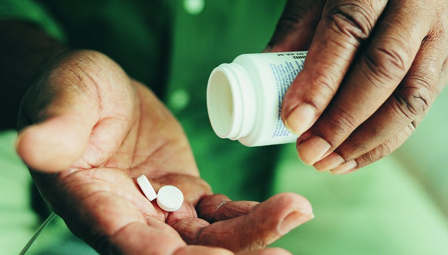 Man taking pills Man taking pills