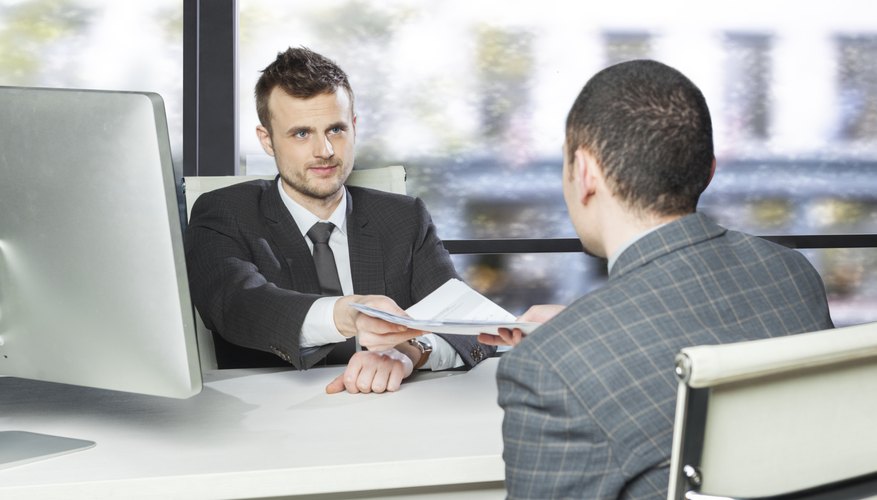 Office - employee receiving document from manager