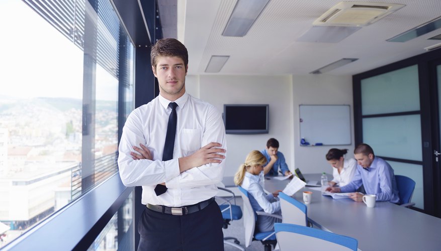 business man portrait on meeting with colleagues in background