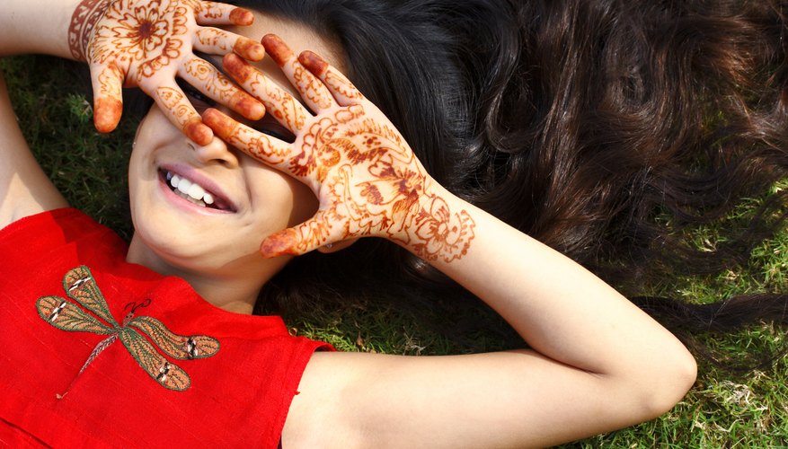 Photo Credit: Visage/Stockbyte/Getty Images Long ago, the henna plant's stem and leaves were ground up and made into a paste as a paint for the skin.