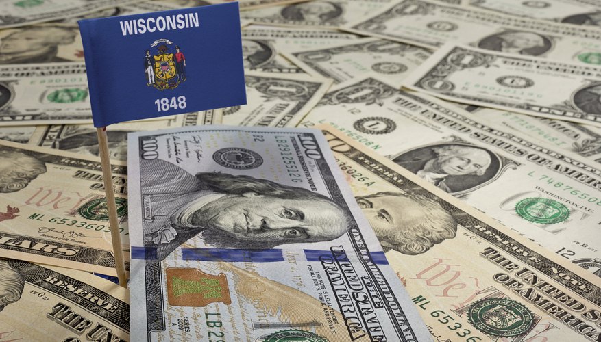 Flag of Wisconsin sticking in various american banknotes.(series