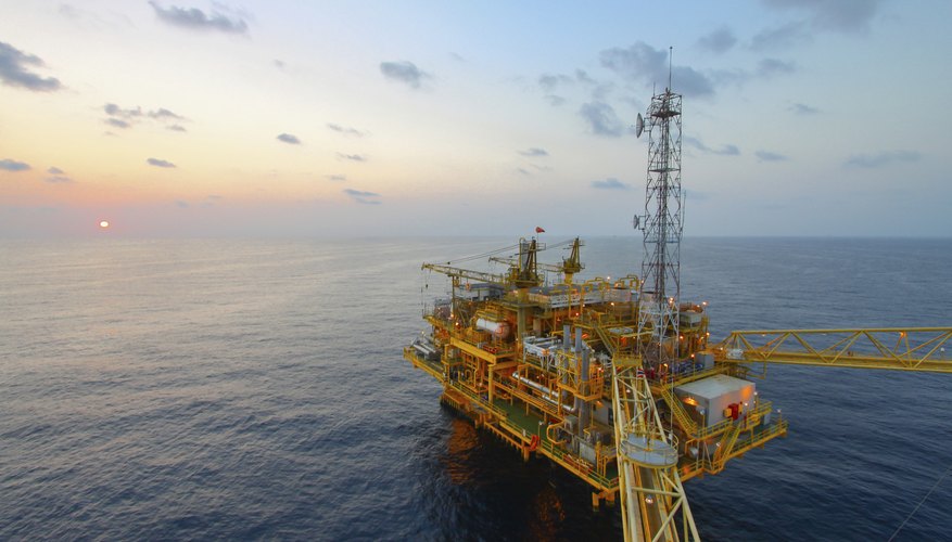 Oil and gas platform in sunset or sunrise time
