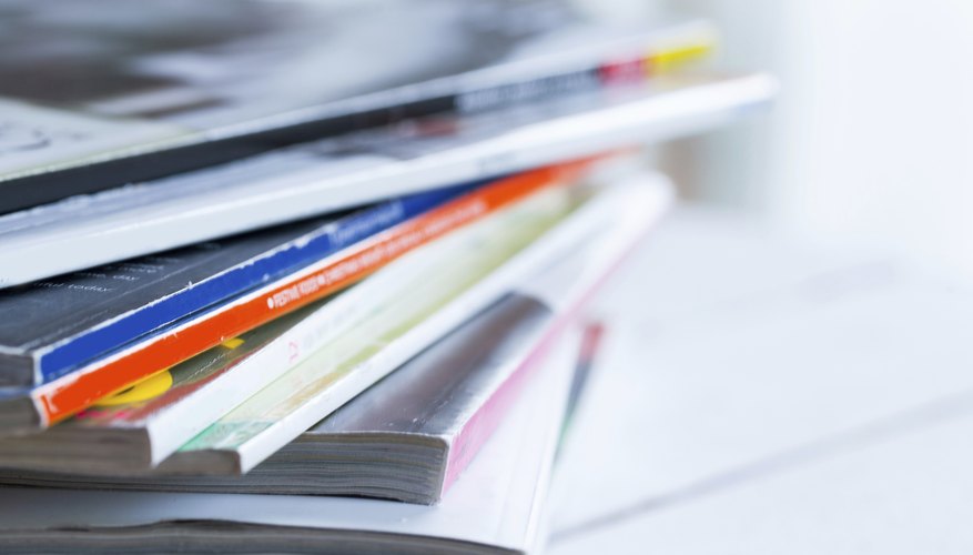 Pile of colorful magazines on a table