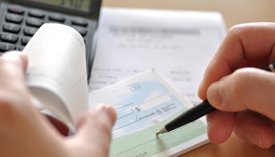 Business man writing check