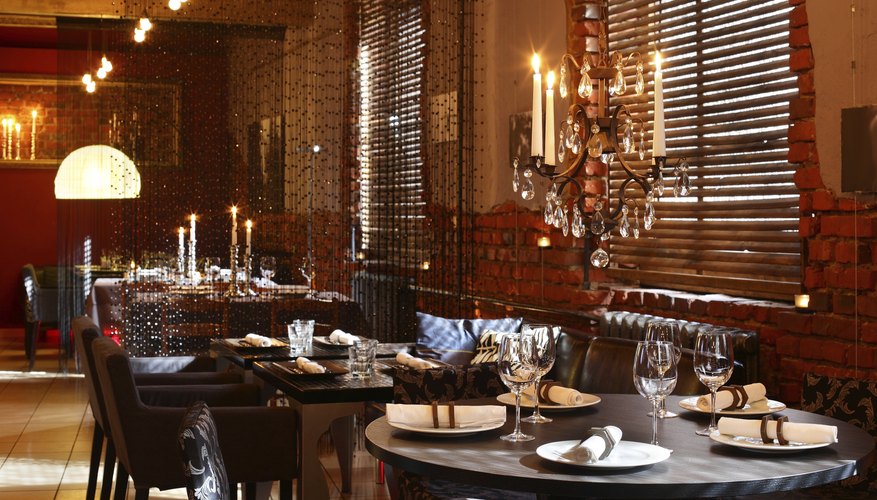 Photo Credit: fiphoto/iStock/Getty Images A restaurant with exposed brick and chandeliers offers a contrasting vision
