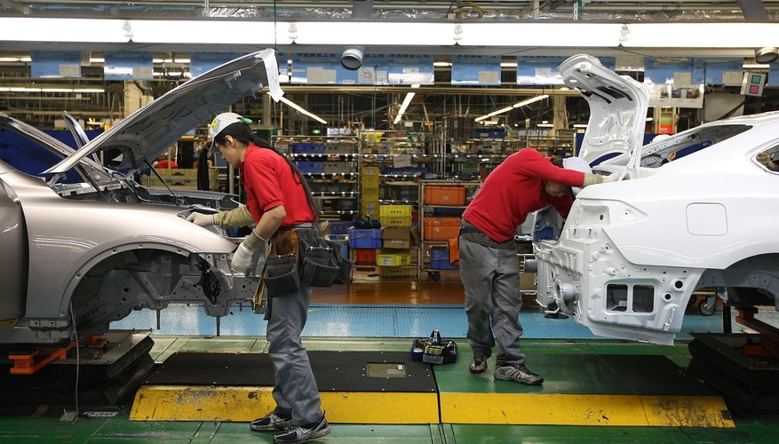 Photo Credit: Junko Kimura/Getty Images News/Getty Images Workers assemble vehicles in Japan