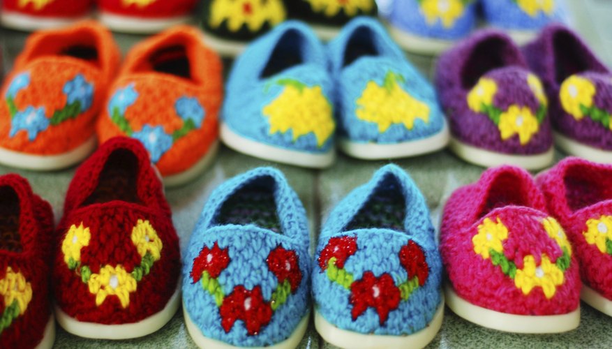 Photo Credit: pasaraporn/iStock/Getty Images Shoes for children made by a craft group