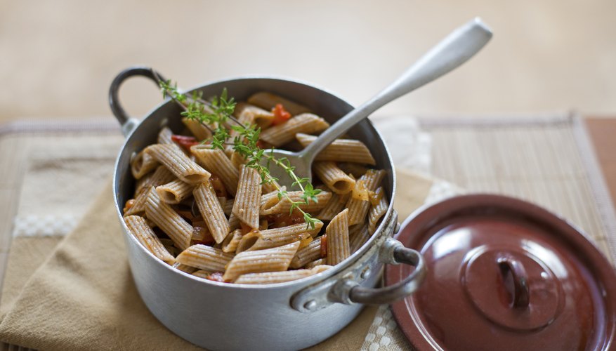 Pot filled with whole wheat pasta. Pot filled with whole wheat pasta.