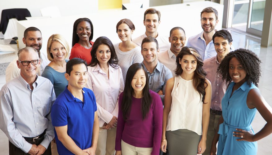Portrait Of Multi-Cultural Office Staff Standing In Lobby