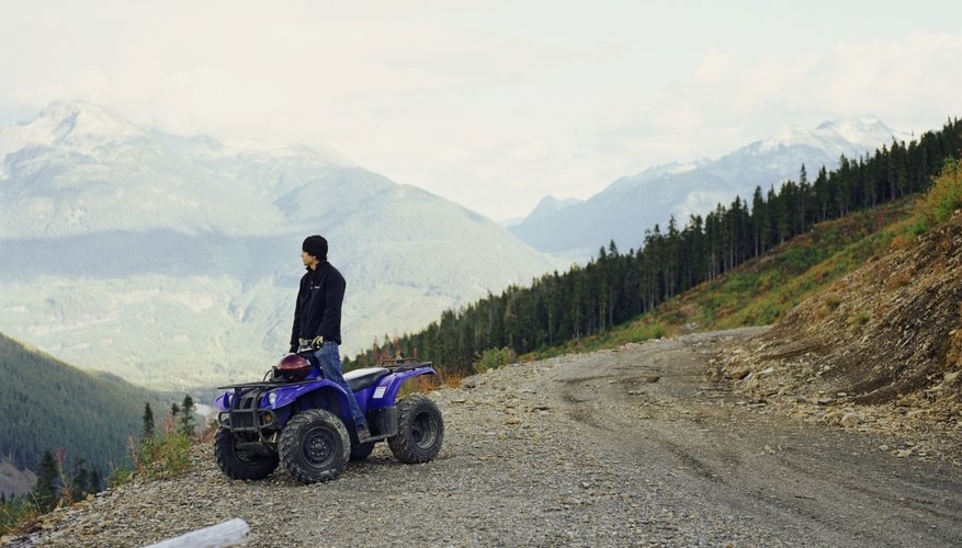 ATV on side of dirt road ATV on side of dirt road