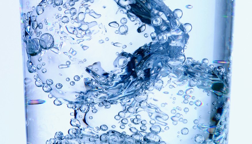 Photo Credit: Digital Vision./Photodisc/Getty Images Heat from surrounding air can also gradually raise the drink's overall temperature.
