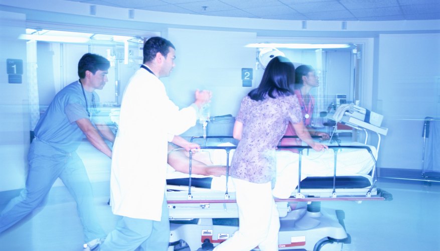 Medical team pushing a patient on a gurney