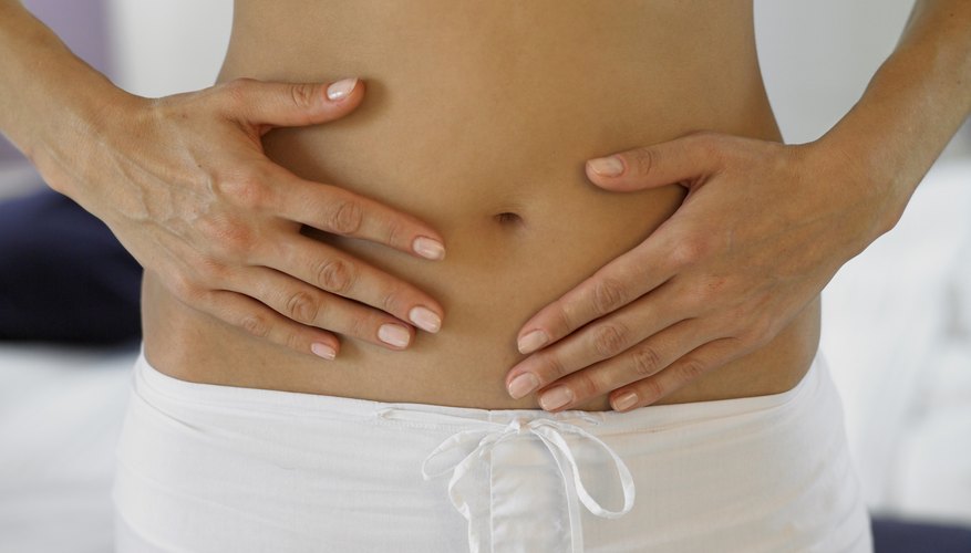 Woman holding stomach Woman holding stomach