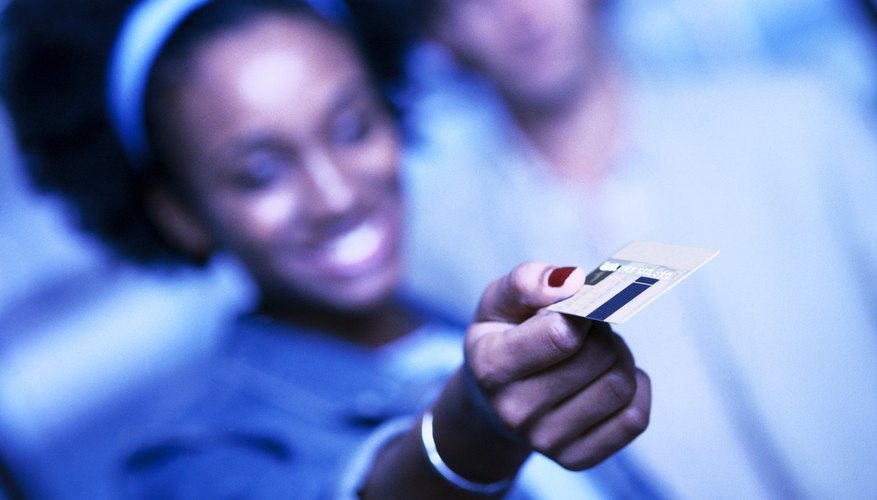 Checking the fine print of your credit card terms can uncover travel perks.