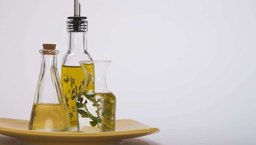 Several types of olive oil in bottles. Several types of olive oil in bottles.