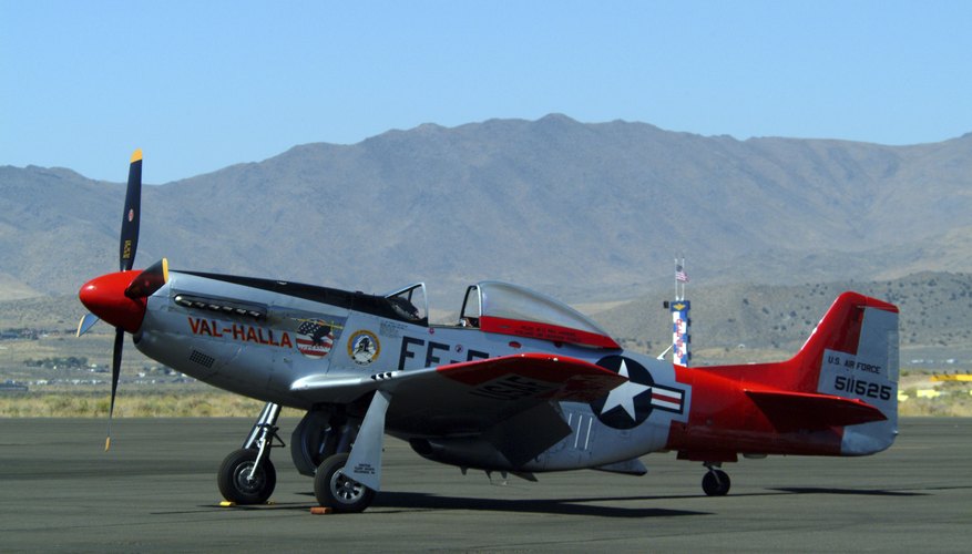 Vintage military aircraft on runway at airport