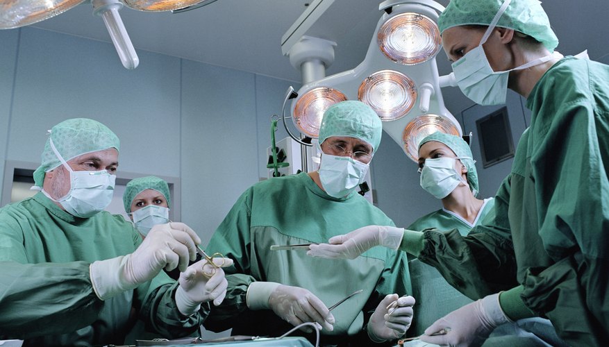 Surgeons operating. Surgeons operating.