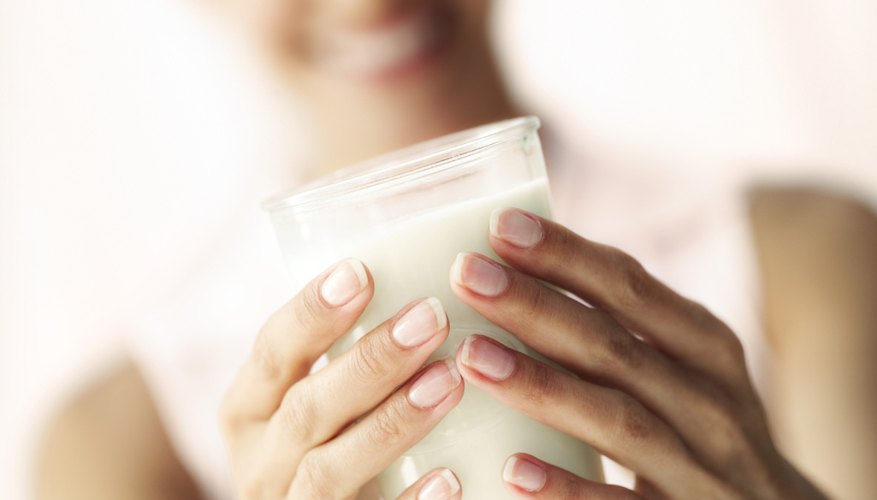 Woman holding milk Woman holding milk