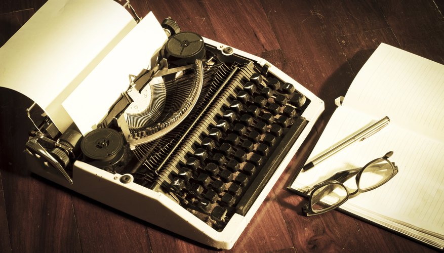 Typewriter with book and eyeglasses