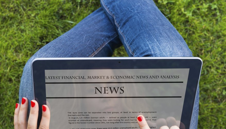 Reading news on digital tablet