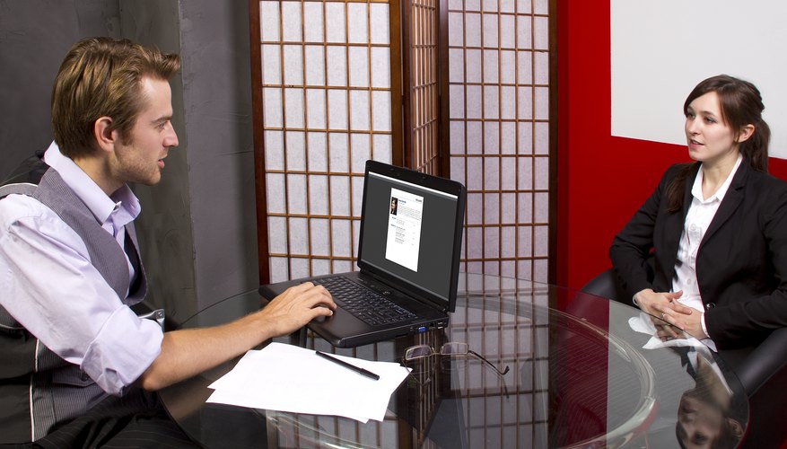 Manager questioning while reviewing workers job performance