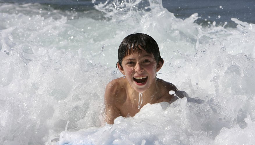 Boy playing in ocean Boy playing in ocean