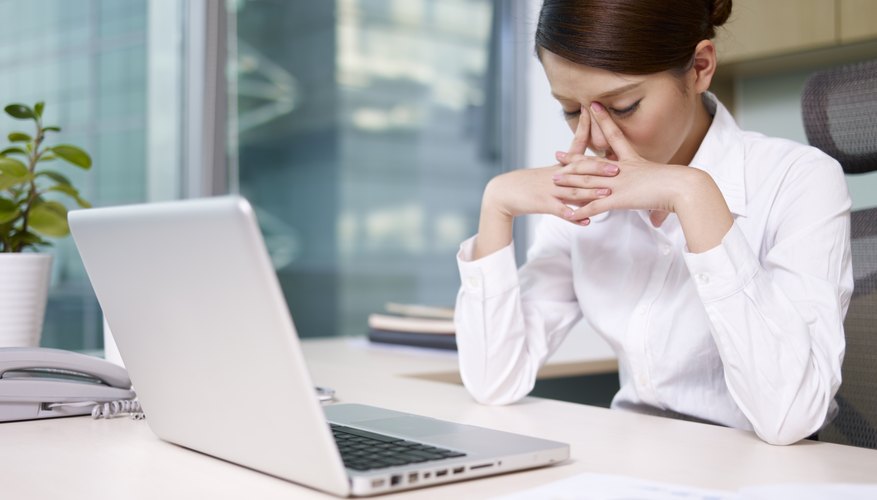 Photo Credit: imtmphoto/iStock/Getty Images woman stressed at work
