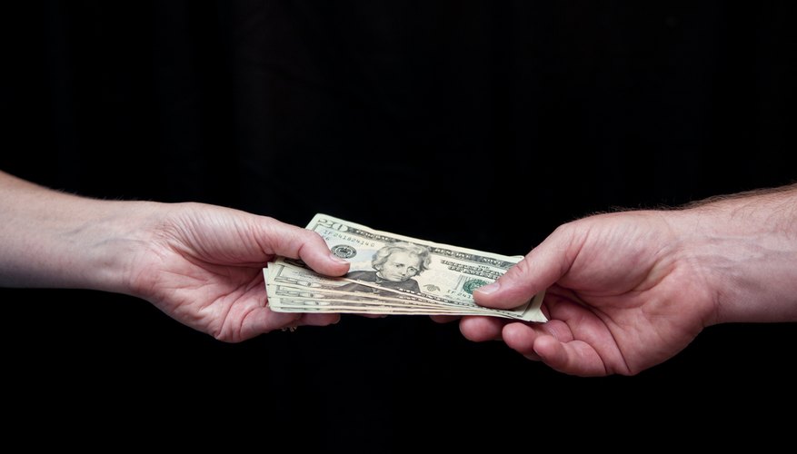 Man hands woman money
