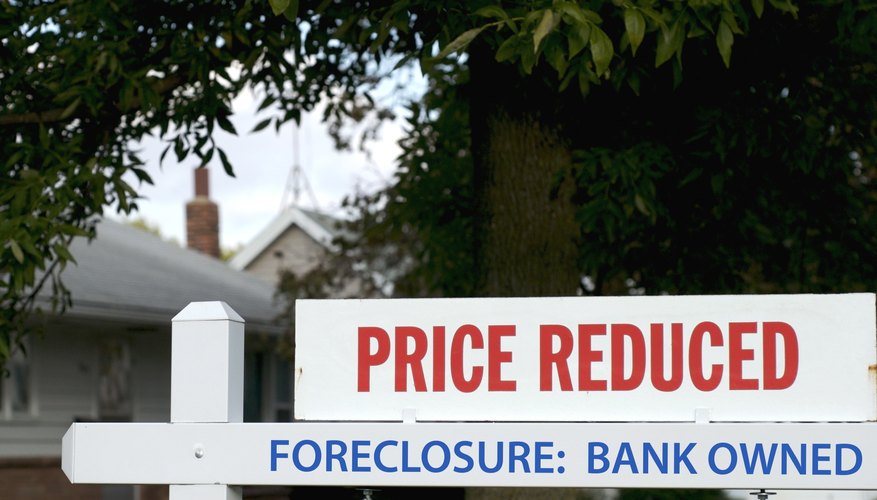 Foreclosed property sign in front of home