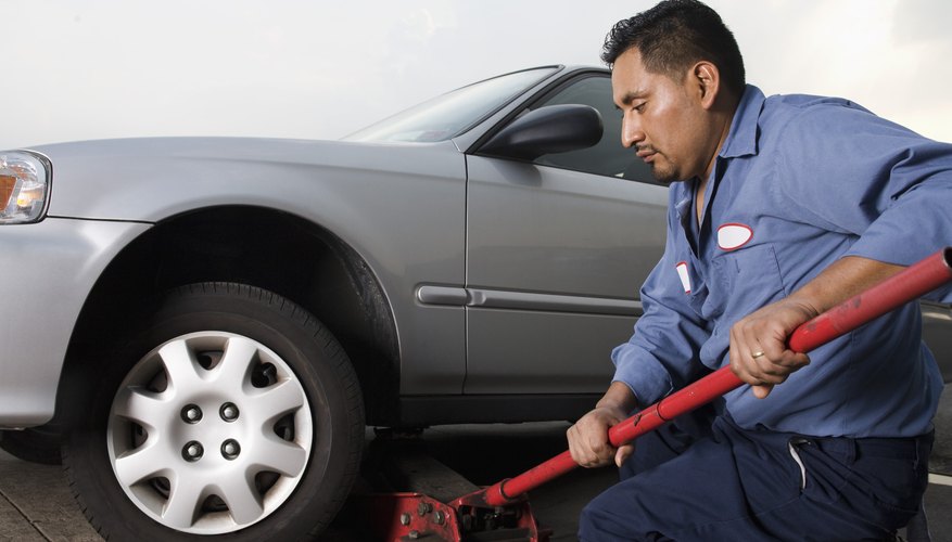 Mechanic with car and jack