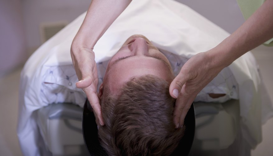 Patient lying on back before PET scan Patient lying on back before PET scan